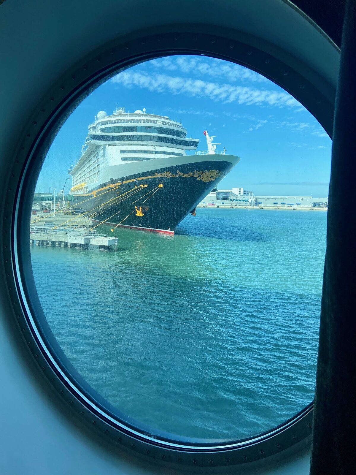 Disney ship through porthole on MSC Meraviglia